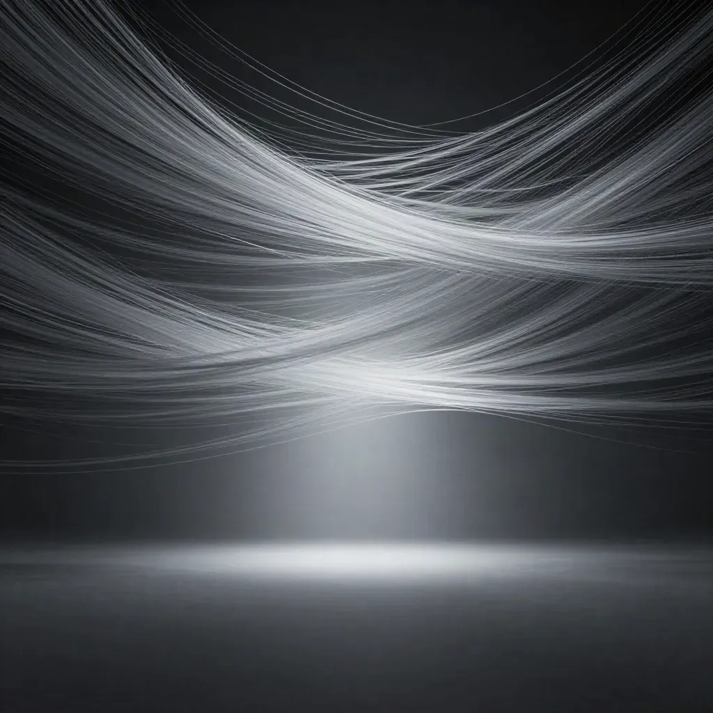 Silver light filaments converge into a soft bloom in dark graphite haze